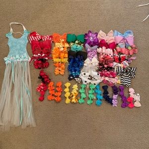 80 hair bows and holder.most have never been worn.